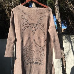 Light brown sweater with a design of an owl